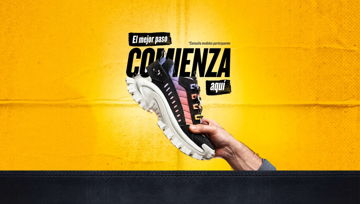 Tenis Cat para mujer con suela gruesa y diseño multicolor sobre fondo amarillo con texto El mejor paso comienza aquí.